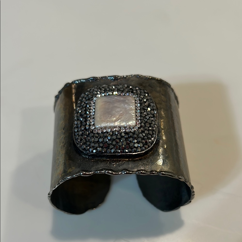 Elegant Silver  cuff with pearl center stone and marcasite surronding the pearl